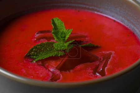 Photo for Cold beetroot soup with mint in a bowl on a gray background - Royalty Free Image