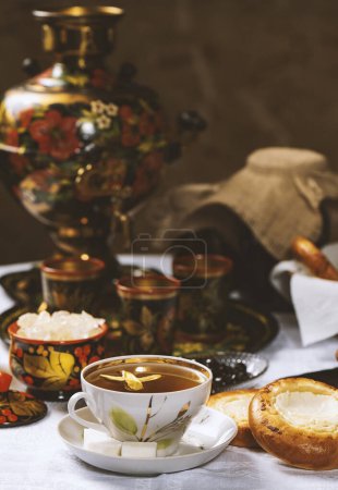 Photo for Cup of tea with lemon and honey on a wooden background. Ukrainian  or Russian style - Royalty Free Image