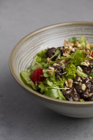 Photo for Chicken liver saladFresh salad with quinoa, olives, tomato and arugula .chicken liver salad - Royalty Free Image