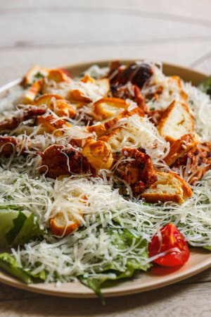 Photo for Crispy chicken salad with parmesan cheese and cherry tomatoes . Caesar salad - Royalty Free Image