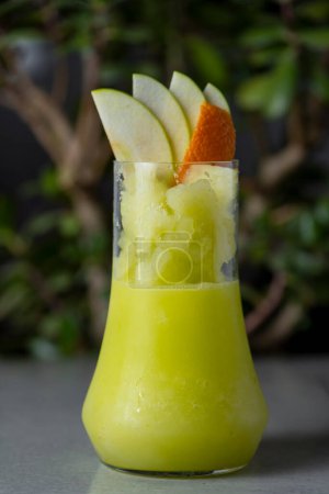 Photo for Refreshing summer cocktail with apple, orange and kiwi - Royalty Free Image
