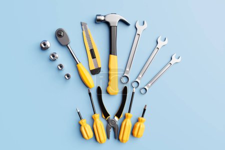 Téléchargez les photos : 3D illustration of a metal hammer, screwdrivers, pliers, level, tape measure, electrical tape, cutter with yellow handles on a blue background. 3D render and illustration of a hand tool - en image libre de droit