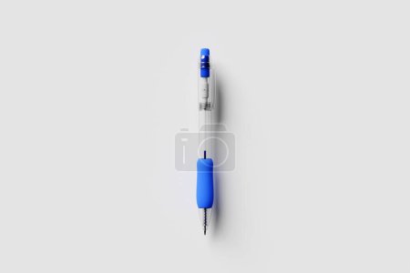 Foto de A simple automatic pen with blue ink in cartoon style on a white isolated background .3D illustration. Stationery - Imagen libre de derechos