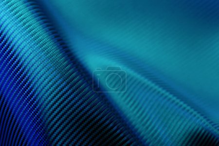 Foto de 3D illustration of the  blue  carbon fabric design element. Close up of the cloth material flying - Imagen libre de derechos