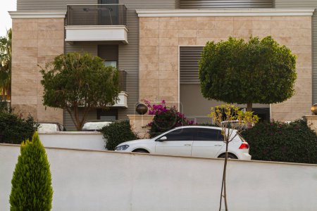 Foto de Side, Turkey -January 21, 2023:    white Volkswagen Golf ,  side   view,  is parked  on the street on a warm summer day - Imagen libre de derechos