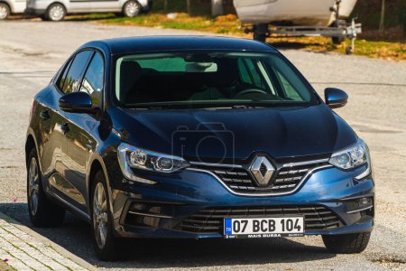 Photo for Side, Turkey -January 21, 2023:   white Renault Megane   is parked  on the street on a warm  day against the backdrop of a   hotels - Royalty Free Image
