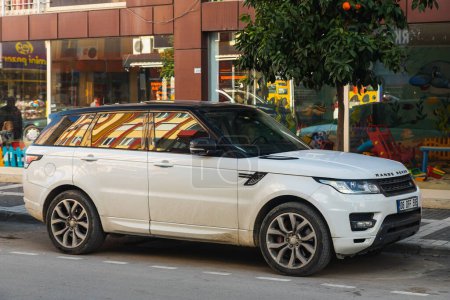 Photo for Side, Turkey -January 23, 2023:       white Land Rover Range Rover Sport  is parked  on the street on a warm day - Royalty Free Image