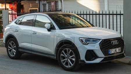 Photo for Side, Turkey -January 23, 2023:       white  Audi Q3   is parking  on the street on a  summer day - Royalty Free Image