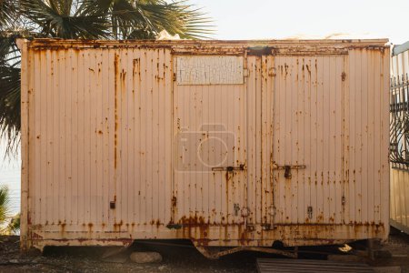 Photo for Iron container with peeling paint for storage and transportation of goods - Royalty Free Image