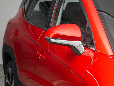 Photo for Side mirror of a  red car close-up. Exterior detail - Royalty Free Image