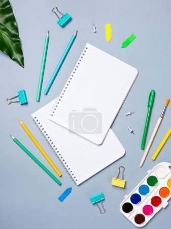 Photo for Table with open notebook with ballpoint pen, stationery. Business concept planning a day, writing a to-do list, checklist. Top view of workspace - Royalty Free Image