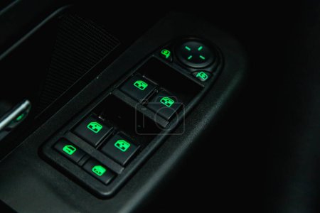 Photo for Novosibirsk, Russia - March 31, 2022:  UAZ Patriot,  close-up of the side door buttons: window adjustment buttons, door lock - Royalty Free Image