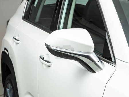 Photo for Side mirror of a  white  car close-up. Exterior detail - Royalty Free Image
