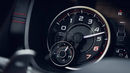 Photo for Close up black car panel, digital bright tachometer. Tachometer arrow shows speed - Royalty Free Image