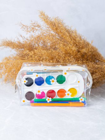 Photo for Close up of pencil case with school supplies on light  background. Back to school concept - Royalty Free Image