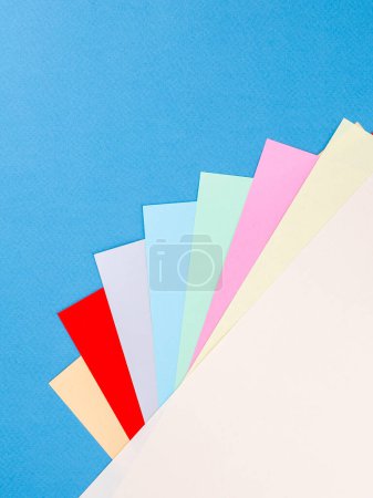 Photo for Colorful paper sheet background  isolated on blue, close up - Royalty Free Image