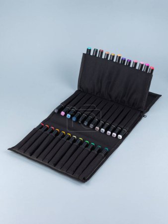 Photo for A set of professional markers in a black  case on a light background. Markers for sketching are many colors. - Royalty Free Image