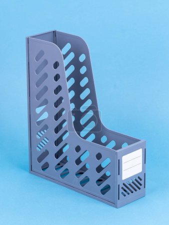 Photo for Vertical paper trays or document holders empty on  blue background - Royalty Free Image