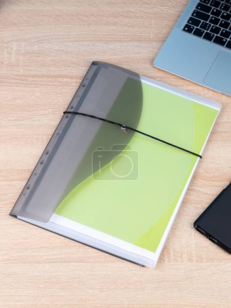 Photo for Transparent   plastic office folder on  wooden background. Office Folder Template - Royalty Free Image