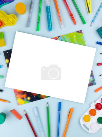 Photo for Open blank sheet of sketchbook with watercolors, gouache, brushes and other stationery on a light background, copy space - Royalty Free Image