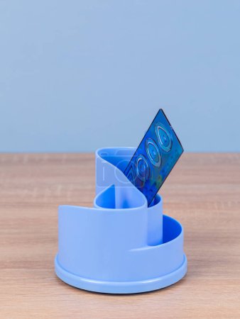 Photo for Blue desktop organizer with school stationary and office supplies over blue background. Back to school, home office, begining of studies concept - Royalty Free Image