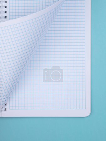 Photo for Grid paper copybook. Light white background on the topic of school, study and learning. Rough textured surface with cellulose fibers. Close-up - Royalty Free Image