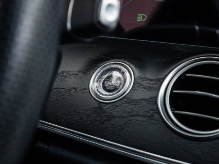 Photo for Novosibirsk, Russia - September 11  , 2023: Mercedes-Benz E-Class, Car dashboard:  black engine start stop button, car interior details. - Royalty Free Image