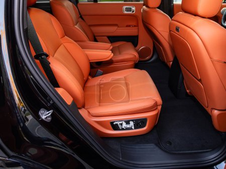 Photo for Novosibirsk, Russia - September 11  , 2023: Li L9, family car interior with  rows of orange leather seats - Royalty Free Image