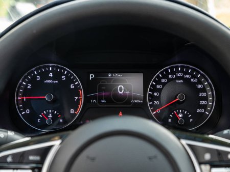 Photo for Novosibirsk, Russia - September 11  , 2023:   Kia K3 , dashboard of the car is illuminated by bright illumination. Speedometer, circle tachometer, oil and fuel level - Royalty Free Image
