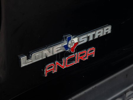Photo for Novosibirsk, Russia - September 11  , 2023:   Dodge Ram 1500,  close-up of the Lone star   ancra logo exclusive on the   car - Royalty Free Image