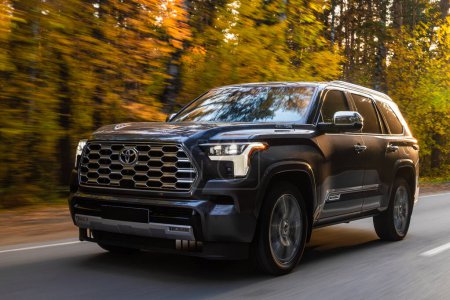 Photo for Novosibirsk, Russia - October 06, 2023: gray Toyota Sequoia, pickup  driving   on the street on a warm day against the backdrop of a forest - Royalty Free Image