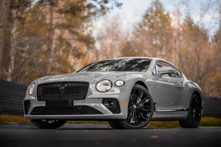 Photo for Novosibirsk, Russia -  October 11  , 2023:  gray  Bentley Continental GT Speed  parked in  park, side view - Royalty Free Image