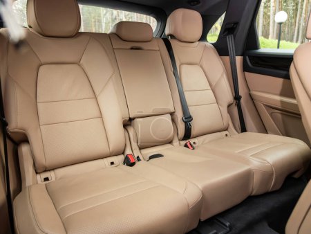 Photo for Novosibirsk, Russia -  October 25  , 2023:  Porsche Cayenne,    Clean car interior: beige  back seats, headrests and belt - Royalty Free Image