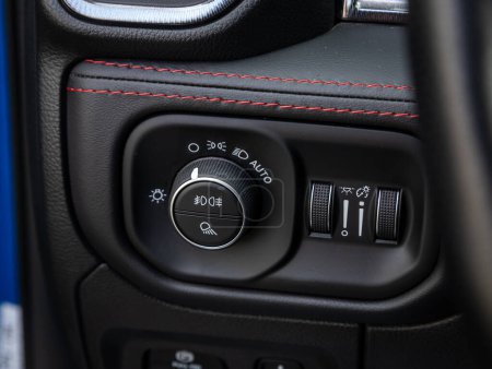 Photo for Novosibirsk, Russia - September 11  , 2023:  Dodge Ram Trx, close-up of the  headlight setting buttons - Royalty Free Image