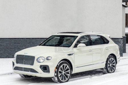 Photo for Novosibirsk, Russia -  November 03  , 2023:  white Bentley Bentayga ,   front view, parked of a city. No other car and people. - Royalty Free Image