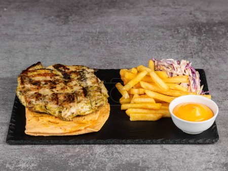 Photo for Chicken kebab with vegetables, fries and sauce on lavash - Royalty Free Image