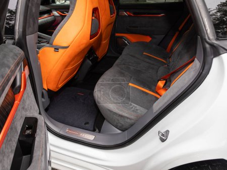 Photo for Novosibirsk, Russia -  November 10  , 2023:    Zeekr 001, Clean car interior: black and orange  back seats, headrests and belts - Royalty Free Image