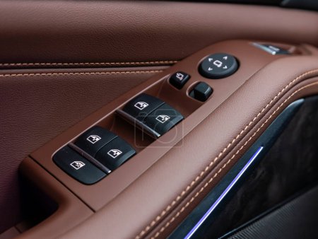 Photo for Novosibirsk, Russia -  November 16  , 2023:       Black BMW X5, close-up of the side door buttons: window adjustment buttons, door lock. - Royalty Free Image