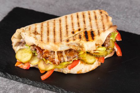 Photo for Turkish chicken doner sandwich. Fast food.Tortilla, burritos, sandwiches, twisted rolls - Royalty Free Image
