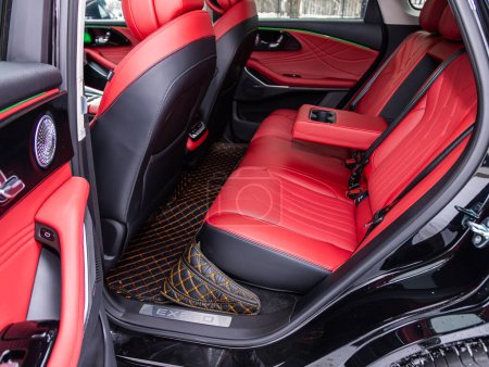 Photo for Novosibirsk, Russia - January  05 , 2024: black EXEED  RX, Close-up of the red  leather rear seats with seats belt. modern car interio - Royalty Free Image
