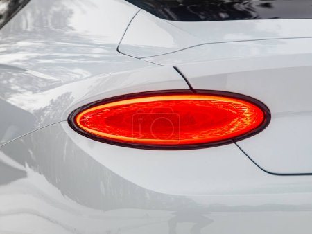 Photo for Novosibirsk, Russia - January  05 , 2024:  white Bentley Continental GT , Close up detail on one of the LED taillights modern car. - Royalty Free Image