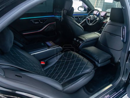 Photo for Novosibirsk, Russia - January  15 , 2024: black luxury Mercedes-Benz S-class,  comfortable passenger seat made of black leather with footrest - Royalty Free Image