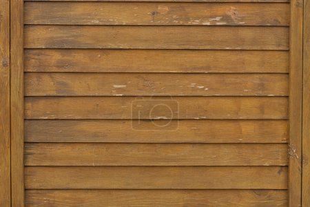 Foto de Primer plano de una pared de madera marrón pintada durante mucho tiempo y la pintura se despegó. Fondo textura marrón - Imagen libre de derechos
