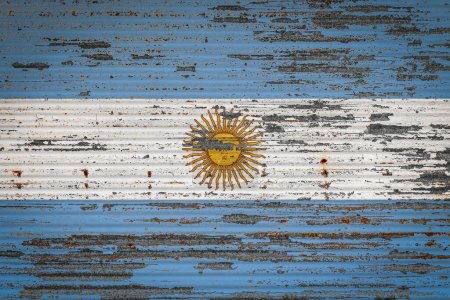 Photo for Close-up of old metal wall with national flag of Argentina . Concept of Argentina export-import, storage of goods and national delivery of goods. Flag in grunge style - Royalty Free Image