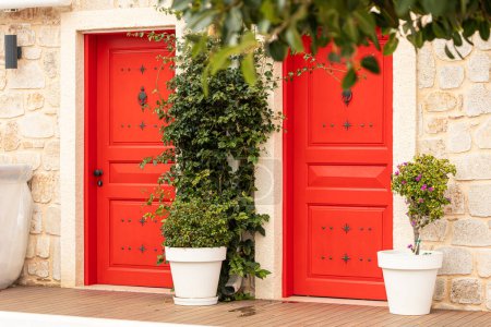 Photo for Traditional white Greek house facade with  red  door - Royalty Free Image