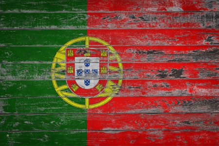 Foto de La bandera nacional de Portugal está pintada sobre tablas de madera desiguales. Símbolo país. - Imagen libre de derechos