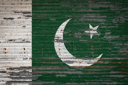 Photo for Close-up of old metal wall with national flag of Pakistan . Concept of Pakistan  export-import, storage of goods and national delivery of goods. Flag in grunge style - Royalty Free Image