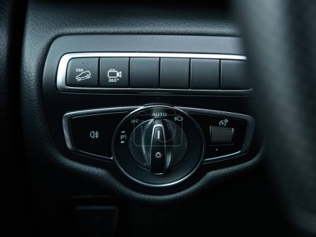 Photo for Novosibirsk, Russia - February  10 , 2024:  Mercedes-Benz V-Class, close-up of the  headlight setting buttons. modern car interior - Royalty Free Image