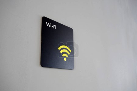 Photo for Close-up of a black wifi sign in a public place with free internet distribution - Royalty Free Image