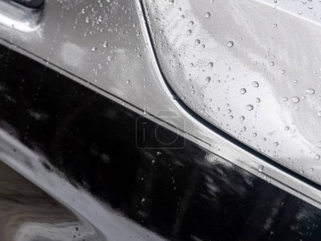 Photo for Close-up of a gray car body under raindrops - Royalty Free Image